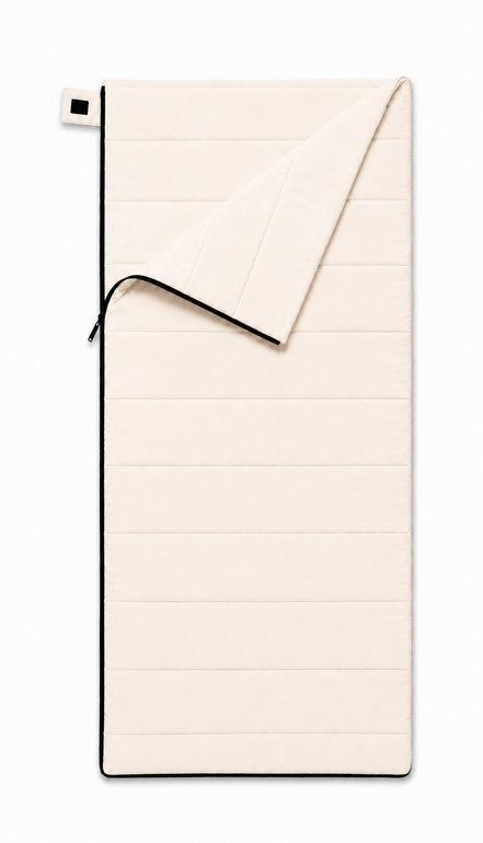 Adult organic cotton sleeping bag in undyed natural cotton, partly unzipped with the top corner folded back