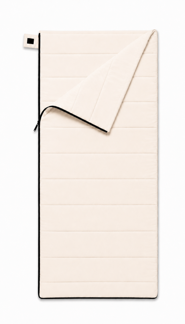Junior organic cotton sleeping bag for kids in undyed natural cotton, top corner folded back