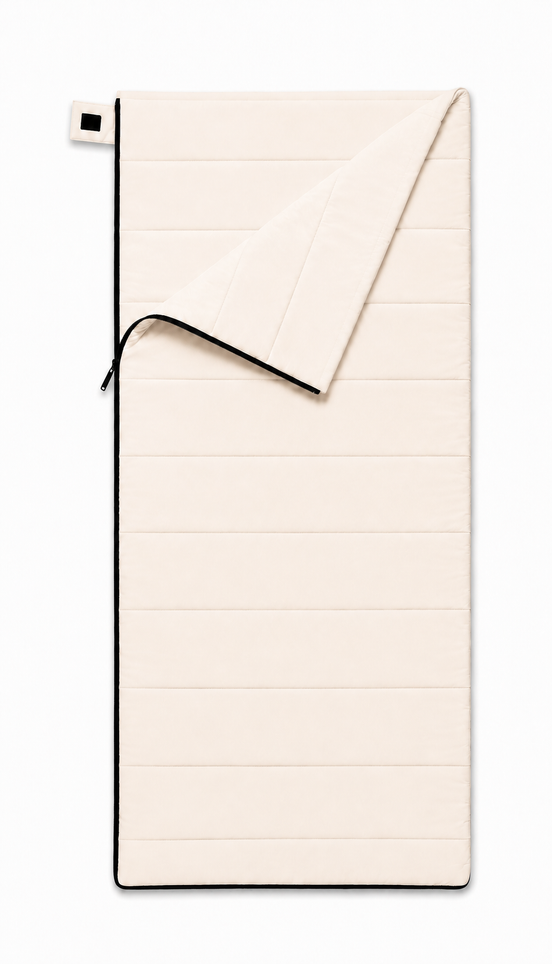 Junior organic cotton sleeping bag for kids in undyed natural cotton, top corner folded back