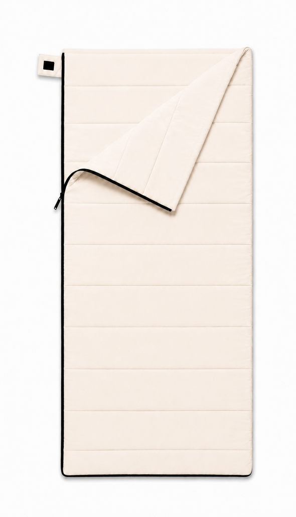 Junior organic cotton sleeping bag for kids in undyed natural cotton, top corner folded back