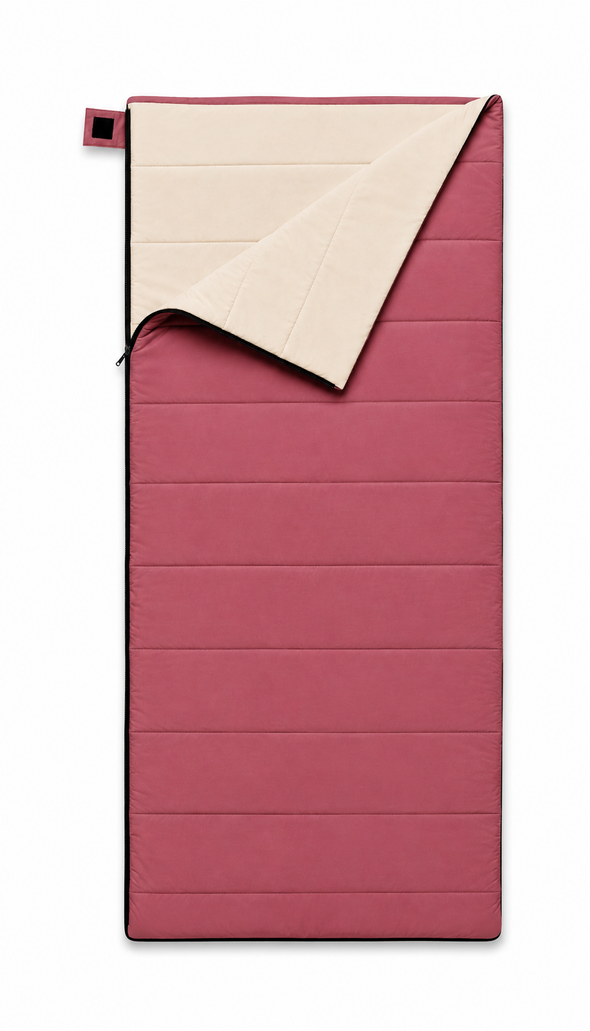 Junior organic cotton sleeping bag for kids in pink with undyed cotton lining, top corner folded back
