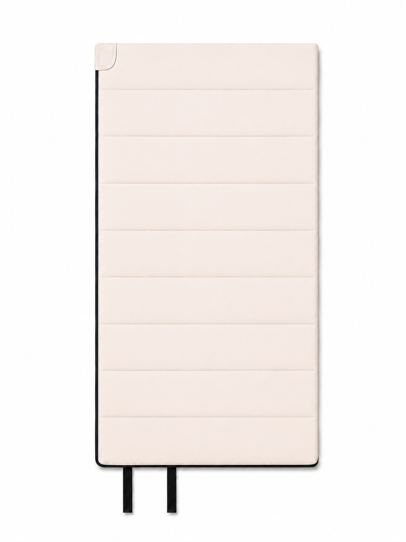 Front of the junior undyed organic cotton sleeping bag with two black tie straps