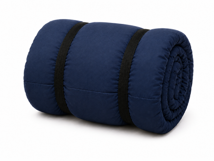Navy blue junior organic cotton sleeping bag rolled up with two black straps